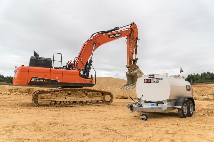 digger-and-tank-in-sand