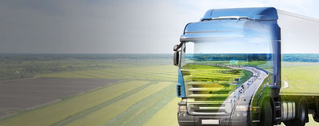 Truck Travelling Across Green Banner