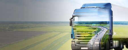 Truck Travelling Across Green Banner